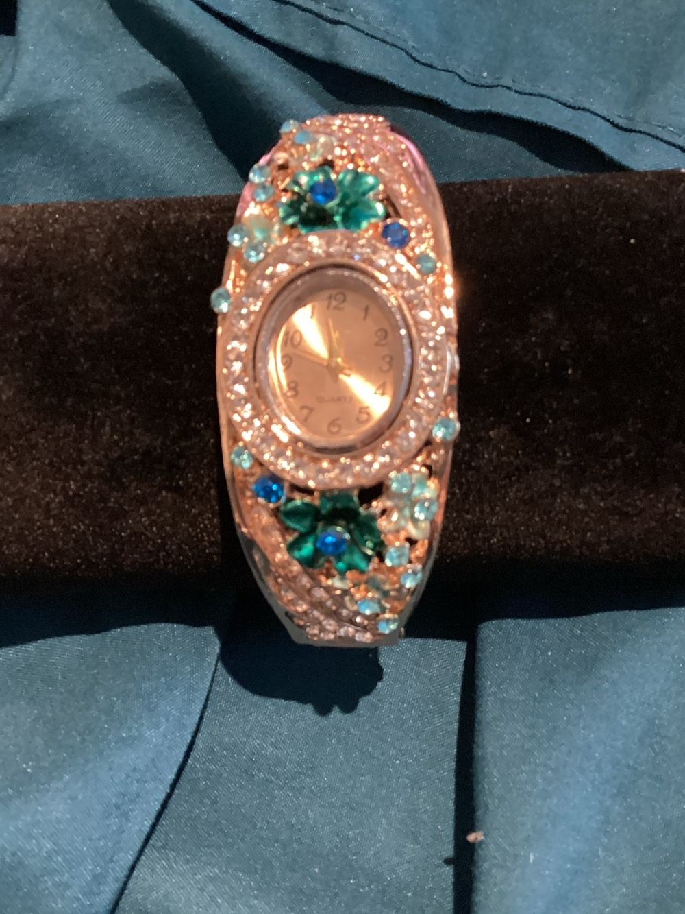 Rose Gold Floral Crystal Bangle Watch with Teal and Blue Accents